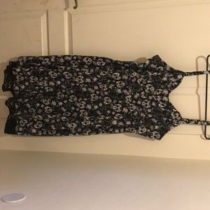 Sleeveless black dress with skulls size 20